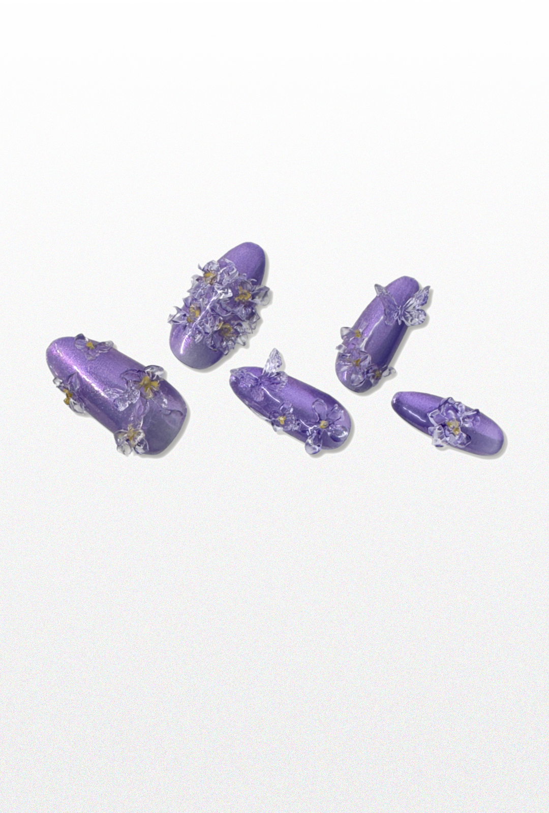 Set of purple floral press-ons.