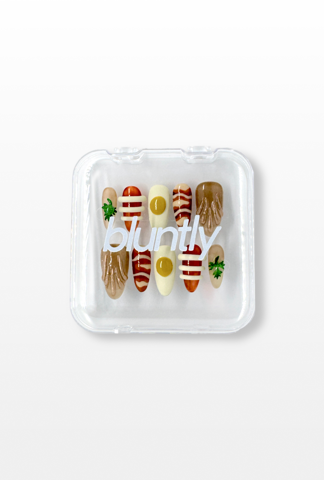Set of false nails in a clear case with 'bluntly' branding on a light gray background