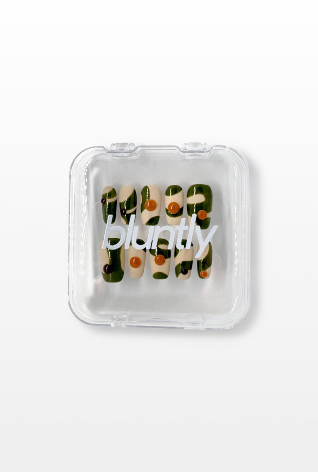 Clear plastic packaging with text and small items on a white background