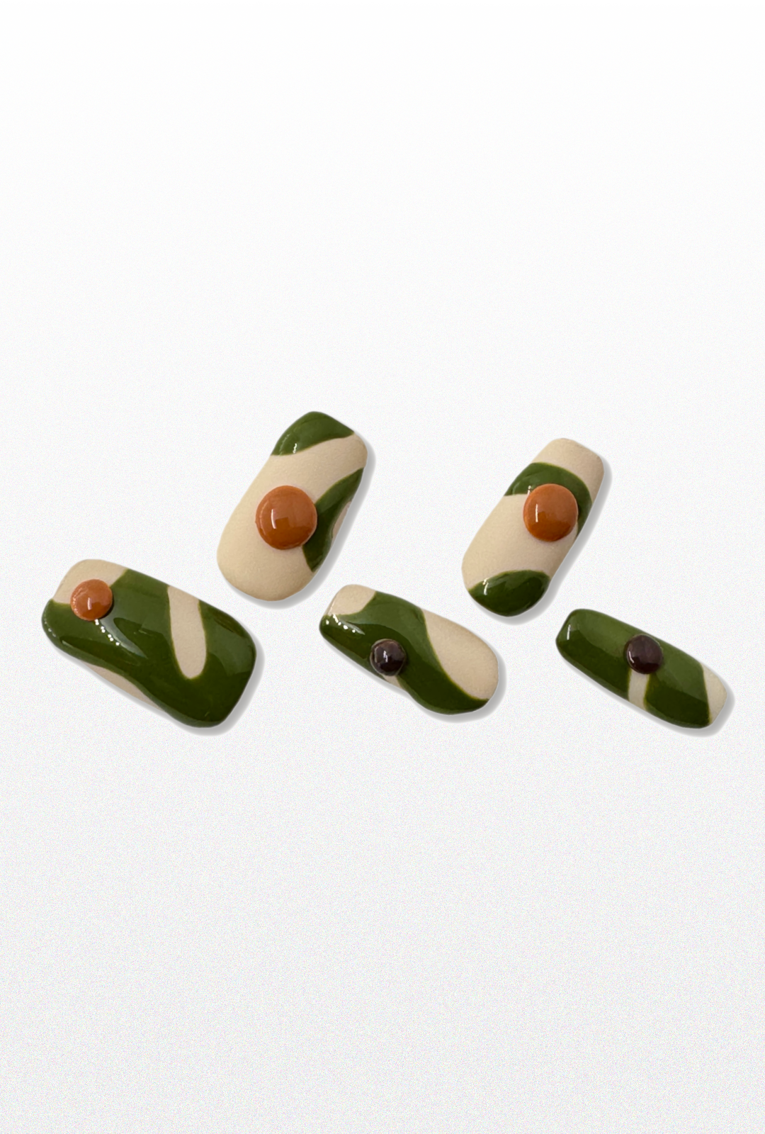 Set of green, orange, beige and brown press-ons.